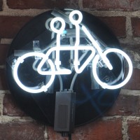 A light bulb in the shape of a tandem bicycle from the wall of the Tandem Coffee Roasters Roastery