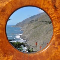 A view through the "Portal on the Big Sur" at Ragged Point Inn, looking north along the coastline.