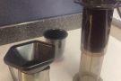 An Aeropress funnel is useful when plunging into a jug. Plus, train tables are more stable.