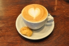 And the end result, my cappuccino, served with a little biscuit on the side.