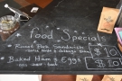 The weekend food specials are chalked on the counter-top.