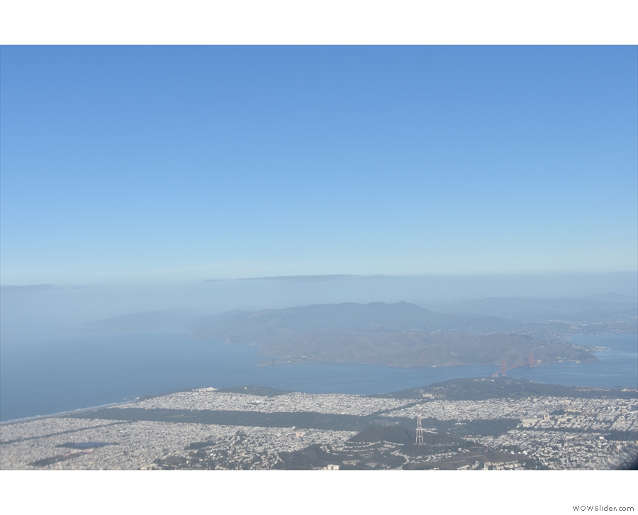 ... flying south of the Twin Peaks with the Golden Gate Park and Presidio in the distance...