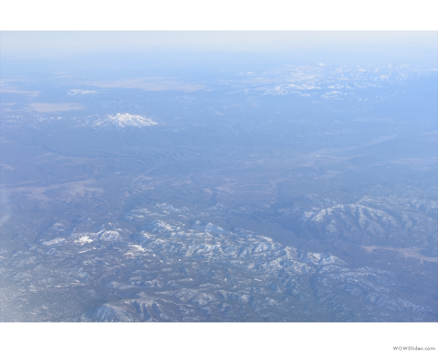 More snow-capped mountains, probably in western New Mexico.