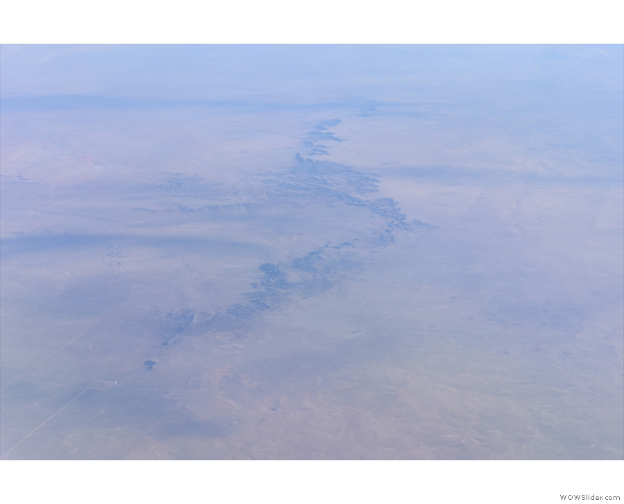 ... gouged by river valleys like this one (I think that's the Pecos River).
