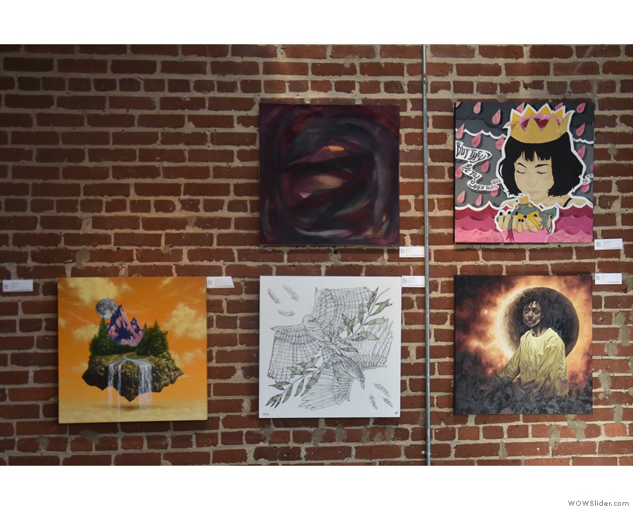 The exposed brick walls are covered with works of art, all of which, I believe, are for sale.