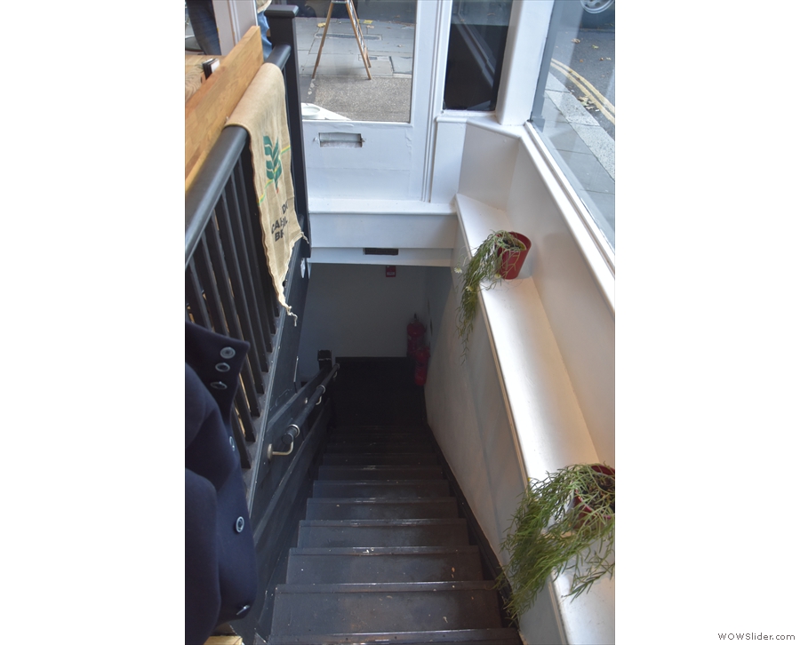 Instead it's beside these stairs, which lead down to the basement, where you'll find...
