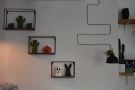 ... while these shelves, and their cactii, are on the wall to the right...