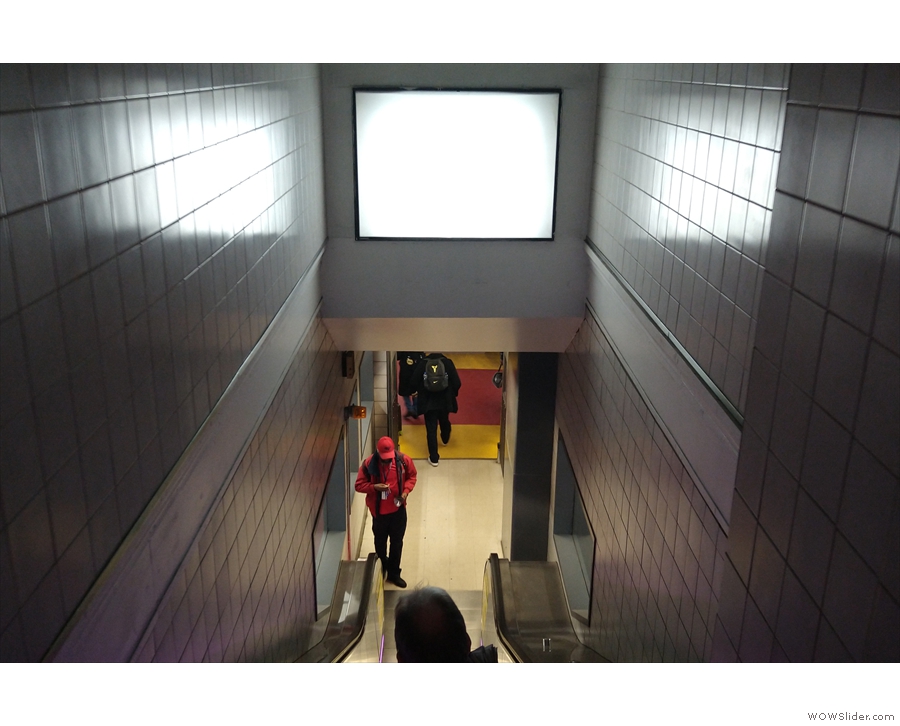 The descent from the concourse to the platform at New York Penn Station. The photo is...
