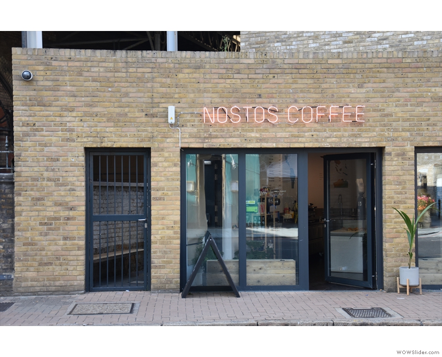 The entrance is under the 'coffee' on the right of the left-hand window. Don't be fooled...
